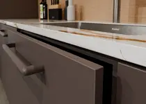 Here you can see the OSTERMANN ABS edging Cacao Orinoco anti-fingerprint Excellent Matt and the matching furniture handle Soraya.