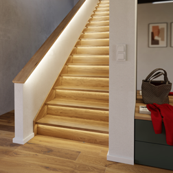 Illuminated staircase in the hallway
