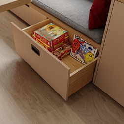 Ausgezogener Schubkasten mit Spielen drin