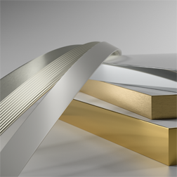 Three aluminium edgings next to boards with a metal finish.