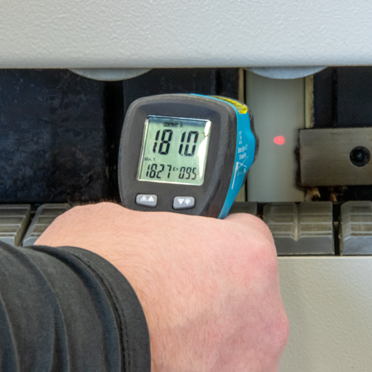 Check the adhesive temperature at the glue applicator roll