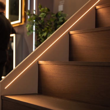 LED strips by Sensio provide atmospheric lighting for the staircase.