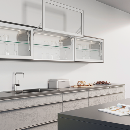 white kitchen cabinet with glass fronts and flap lift system